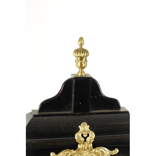 1102 - SPENCER & PERKINS, LONDON. A GEORGE III EBONIZED ORMOLU MOUNTED BRACKET CLOCK, having a bell top ped... 