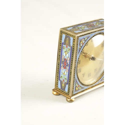 1103 - A 1930’S KIENZLE GERMAN CHAMPLEVE ENAMEL ALARM CLOCK the square silvered case raised on bun feet enc... 