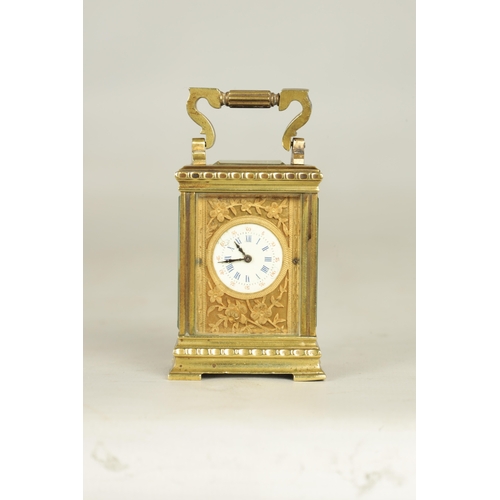 1111 - A LATE 19TH CENTURY FRENCH BRASS CARRIAGE CLOCK OF TINY PROPORTIONS the decorative case with flower ... 