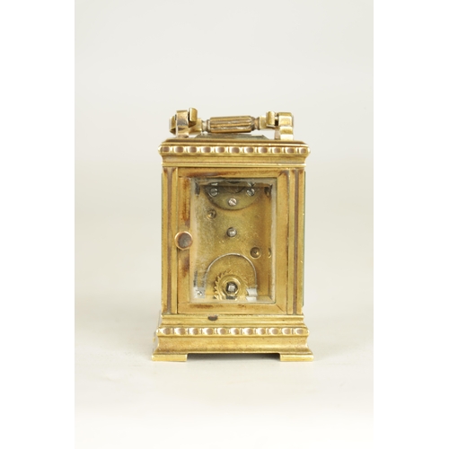 1111 - A LATE 19TH CENTURY FRENCH BRASS CARRIAGE CLOCK OF TINY PROPORTIONS the decorative case with flower ... 