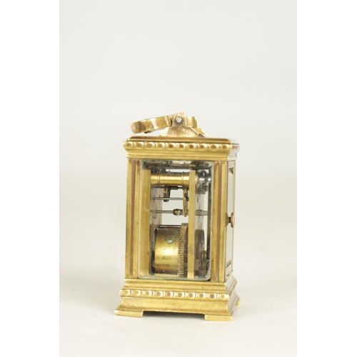 1111 - A LATE 19TH CENTURY FRENCH BRASS CARRIAGE CLOCK OF TINY PROPORTIONS the decorative case with flower ... 