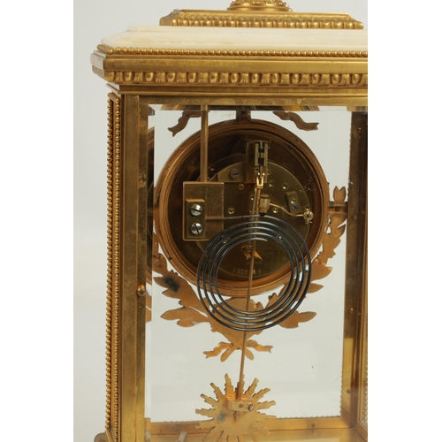 1112 - A FINE LATE 19TH CENTURY GILT BRASS AND WHITE MARBLE FRENCH EMPIRE STYLE MANTEL CLOCK the stylish ca... 