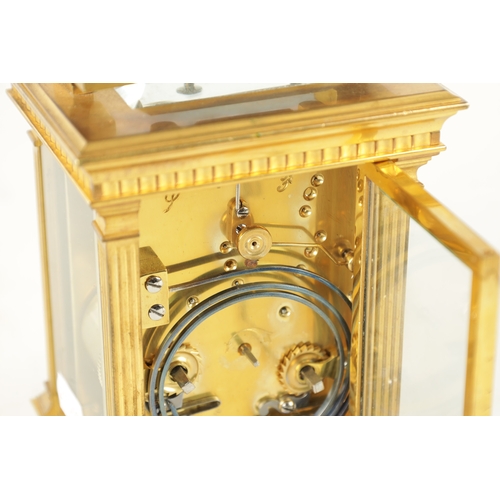 1114 - A LATE 19TH CENTURY FRENCH BRASS CASED REPEATING CARRIAGE CLOCK with filigree masked dial and enamel... 