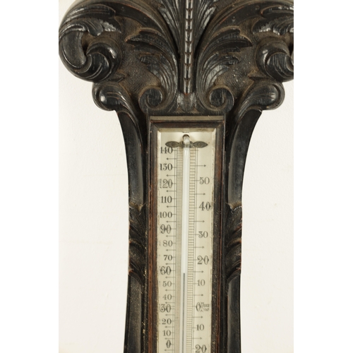 1133 - A LARGE LATE 19TH CENTURY CARVED OAK ANEROID BAROMETER with calibrated porcelain thermometer and bar... 