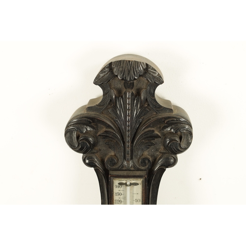 1133 - A LARGE LATE 19TH CENTURY CARVED OAK ANEROID BAROMETER with calibrated porcelain thermometer and bar... 