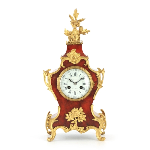 1140 - A LATE 19TH CENTURY FRENCH TORTOISESHELL AND ORMOLU MOUNTED MANTEL CLOCK the shaped case having appl... 