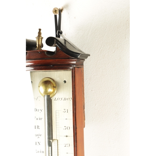 1153 - GILL & CO. LONDON. A LATE GEORGIAN FIGURED MAHOGANY BOW FRONTED STICK BAROMETER, with swan neck pedi... 