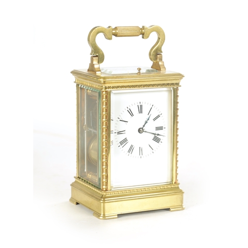 1160 - A LATE 19TH CENTURY FRENCH REPEATING CARRIAGE CLOCK the brass case with ribbed corners enclosing an ... 