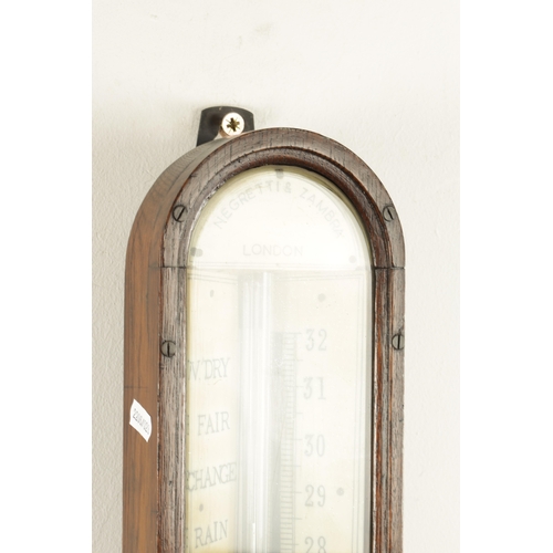 1175 - NEGRETTI & ZAMBRA, LONDON. A LATE 19TH CENTURY OAK CASE STICK BAROMETER, with calibrated ivorine bar... 