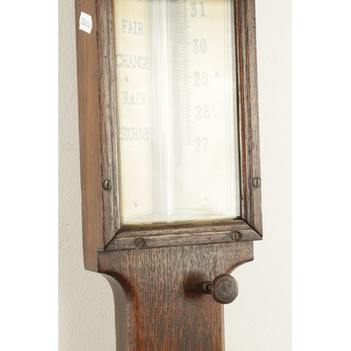 1175 - NEGRETTI & ZAMBRA, LONDON. A LATE 19TH CENTURY OAK CASE STICK BAROMETER, with calibrated ivorine bar... 