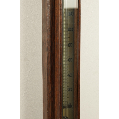 1175 - NEGRETTI & ZAMBRA, LONDON. A LATE 19TH CENTURY OAK CASE STICK BAROMETER, with calibrated ivorine bar... 