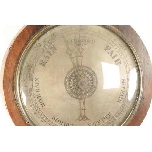 1182 - A FIGURED MAHOGANY CLOCK BAROMETER SIGNED NEGRETTI & ZAMBRA, the silvered calibrated barometer dial ... 