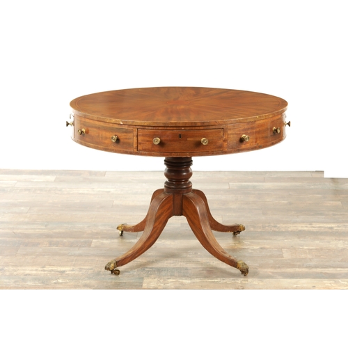 1211 - A REGENCY FIGURED MAHOGANY DRUM TABLE with a segmented inlaid top above a bank of drawers to the fri... 