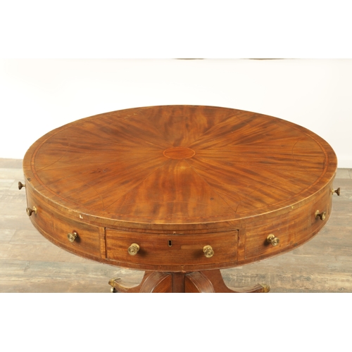 1211 - A REGENCY FIGURED MAHOGANY DRUM TABLE with a segmented inlaid top above a bank of drawers to the fri... 