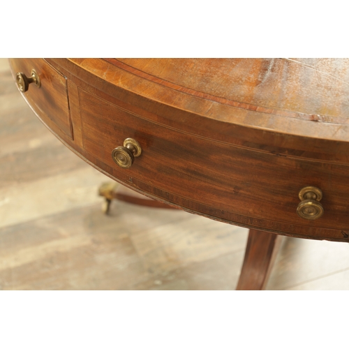 1211 - A REGENCY FIGURED MAHOGANY DRUM TABLE with a segmented inlaid top above a bank of drawers to the fri... 