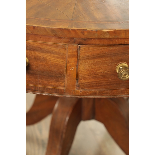 1211 - A REGENCY FIGURED MAHOGANY DRUM TABLE with a segmented inlaid top above a bank of drawers to the fri... 