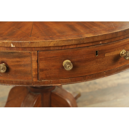 1211 - A REGENCY FIGURED MAHOGANY DRUM TABLE with a segmented inlaid top above a bank of drawers to the fri... 