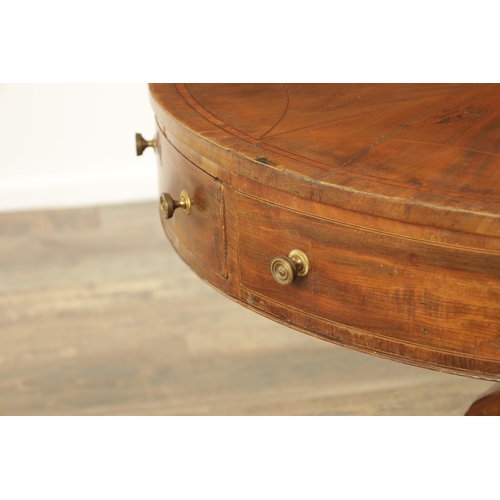 1211 - A REGENCY FIGURED MAHOGANY DRUM TABLE with a segmented inlaid top above a bank of drawers to the fri... 