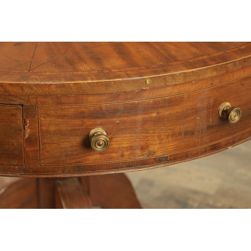 1211 - A REGENCY FIGURED MAHOGANY DRUM TABLE with a segmented inlaid top above a bank of drawers to the fri... 