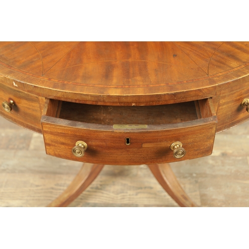 1211 - A REGENCY FIGURED MAHOGANY DRUM TABLE with a segmented inlaid top above a bank of drawers to the fri... 