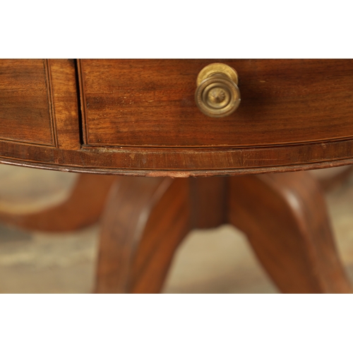 1211 - A REGENCY FIGURED MAHOGANY DRUM TABLE with a segmented inlaid top above a bank of drawers to the fri... 