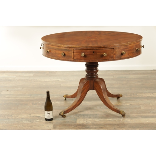 1211 - A REGENCY FIGURED MAHOGANY DRUM TABLE with a segmented inlaid top above a bank of drawers to the fri... 