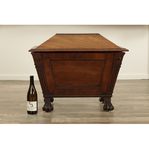 1213 - A LATE REGENCY MAHOGANY SARCOPHAGUS CELLARETTE with lead-lined divided interior, gadrooned panelled ... 