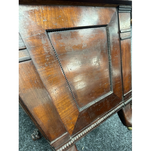 1213 - A LATE REGENCY MAHOGANY SARCOPHAGUS CELLARETTE with lead-lined divided interior, gadrooned panelled ... 