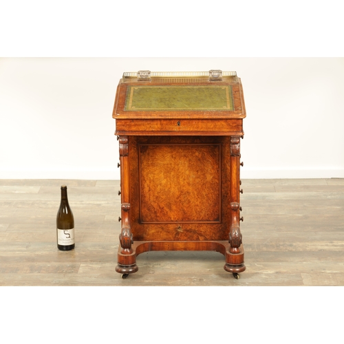 1214 - A VICTORIAN BURR WALNUT DAVENPORT with leathered writing surface scrolled carved columns and side dr... 