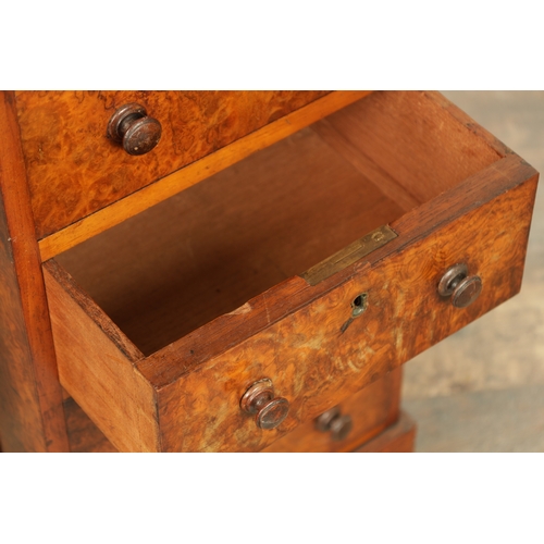 1214 - A VICTORIAN BURR WALNUT DAVENPORT with leathered writing surface scrolled carved columns and side dr... 