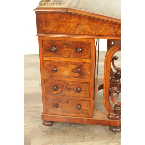 1214 - A VICTORIAN BURR WALNUT DAVENPORT with leathered writing surface scrolled carved columns and side dr... 