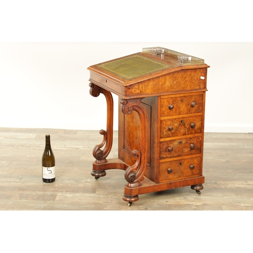 1214 - A VICTORIAN BURR WALNUT DAVENPORT with leathered writing surface scrolled carved columns and side dr... 