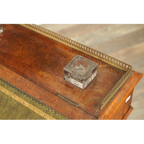 1214 - A VICTORIAN BURR WALNUT DAVENPORT with leathered writing surface scrolled carved columns and side dr... 