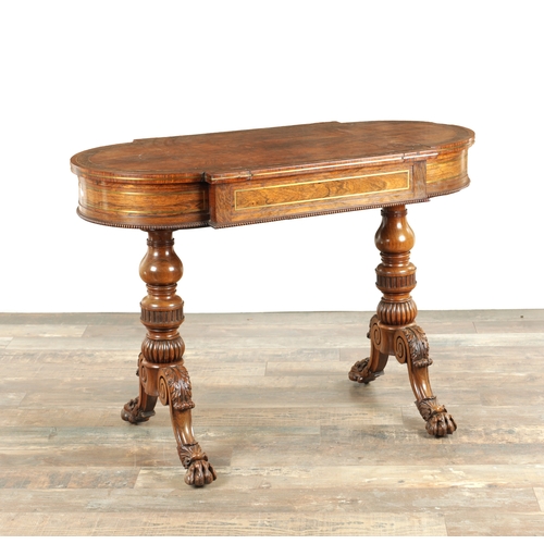 1215 - A FINE REGENCY FIGURED ROSEWOOD AND BRASS INLAID GAMES TABLE IN THE MANNER OF GILLOWS having pierced... 