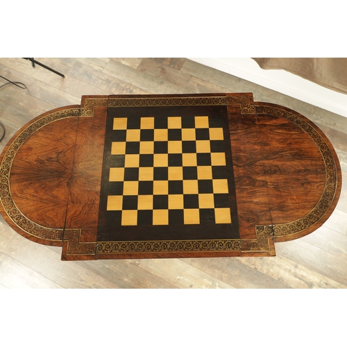 1215 - A FINE REGENCY FIGURED ROSEWOOD AND BRASS INLAID GAMES TABLE IN THE MANNER OF GILLOWS having pierced... 