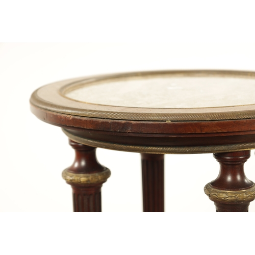 1216 - A 19TH CENTURY MAHOGANY AND BRASS MOUNTED FRENCH LAMP TABLE inset with marble top and gallery edged ... 