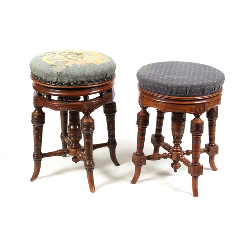 1217 - TWO 19TH CENTURY CIRCULAR WALNUT REVOLVING PIANO STOOLS on turned splayed legs joined by under stret... 