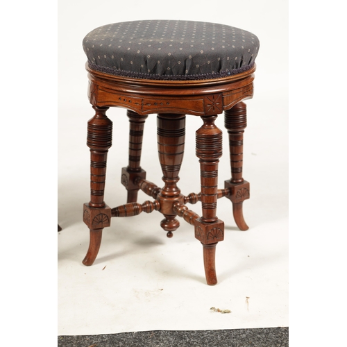 1217 - TWO 19TH CENTURY CIRCULAR WALNUT REVOLVING PIANO STOOLS on turned splayed legs joined by under stret... 