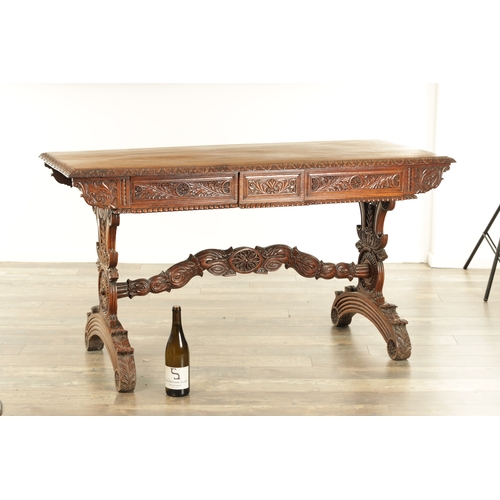 1218 - A 19TH CENTURY ANGLO INDIAN CARVED HARDWOOD LIBRARY TABLE with gadrooned leaf carved edge above frie... 