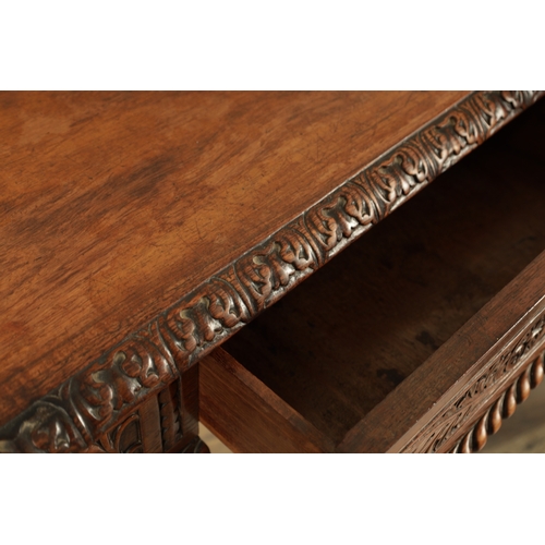 1218 - A 19TH CENTURY ANGLO INDIAN CARVED HARDWOOD LIBRARY TABLE with gadrooned leaf carved edge above frie... 