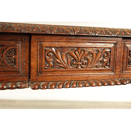 1218 - A 19TH CENTURY ANGLO INDIAN CARVED HARDWOOD LIBRARY TABLE with gadrooned leaf carved edge above frie... 