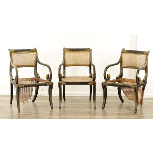 1219 - A RARE SET OF THREE REGENCY PAINTED BERGERE LIBRARY CHAIRS BY JOHN GEE painted in ebony and gilt wit... 