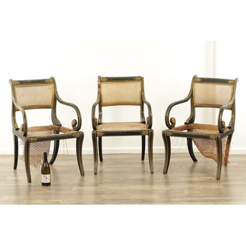 1219 - A RARE SET OF THREE REGENCY PAINTED BERGERE LIBRARY CHAIRS BY JOHN GEE painted in ebony and gilt wit... 