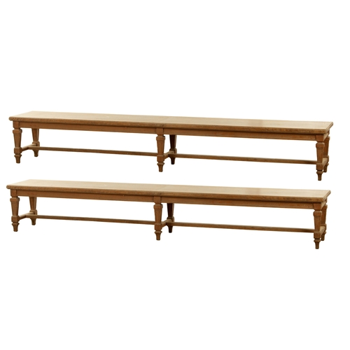 1223 - A PAIR OF LARGE OAK HALL BENCHES IN THE MANNER OF HOLLAND AND SON raised on square tapering legs joi... 