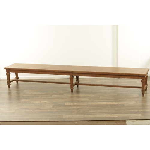 1223 - A PAIR OF LARGE OAK HALL BENCHES IN THE MANNER OF HOLLAND AND SON raised on square tapering legs joi... 