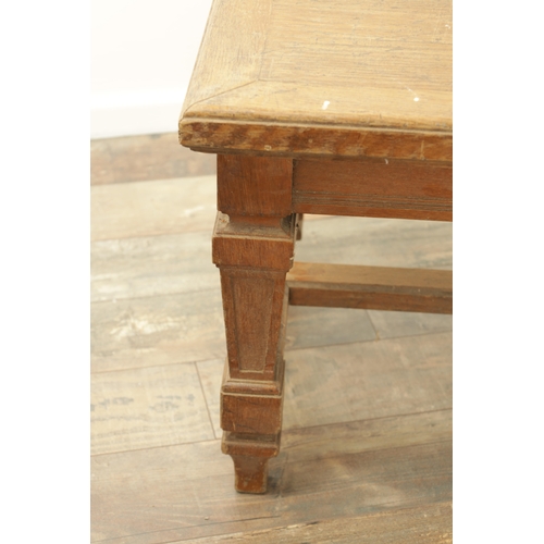 1223 - A PAIR OF LARGE OAK HALL BENCHES IN THE MANNER OF HOLLAND AND SON raised on square tapering legs joi... 