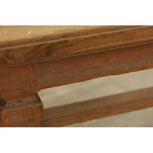 1223 - A PAIR OF LARGE OAK HALL BENCHES IN THE MANNER OF HOLLAND AND SON raised on square tapering legs joi... 