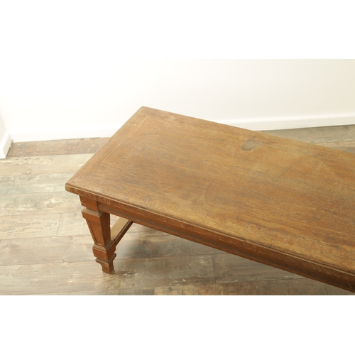 1223 - A PAIR OF LARGE OAK HALL BENCHES IN THE MANNER OF HOLLAND AND SON raised on square tapering legs joi... 