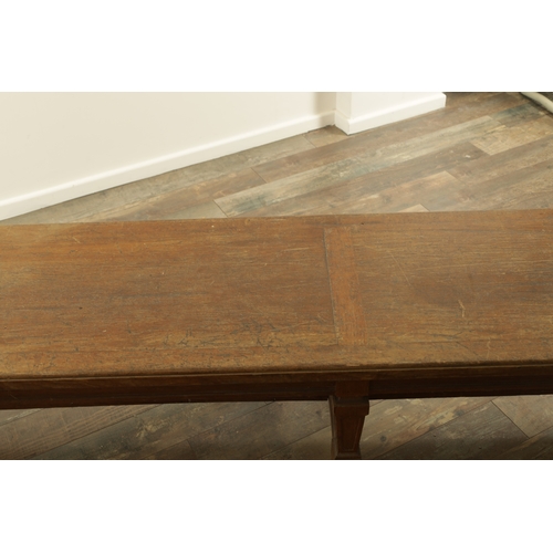 1223 - A PAIR OF LARGE OAK HALL BENCHES IN THE MANNER OF HOLLAND AND SON raised on square tapering legs joi... 