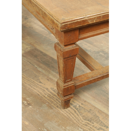 1223 - A PAIR OF LARGE OAK HALL BENCHES IN THE MANNER OF HOLLAND AND SON raised on square tapering legs joi... 